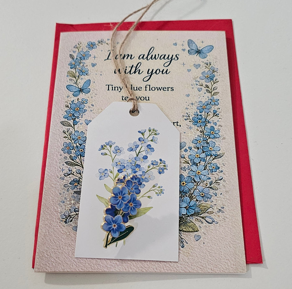 Condolence card with forget-me-not pin and tag