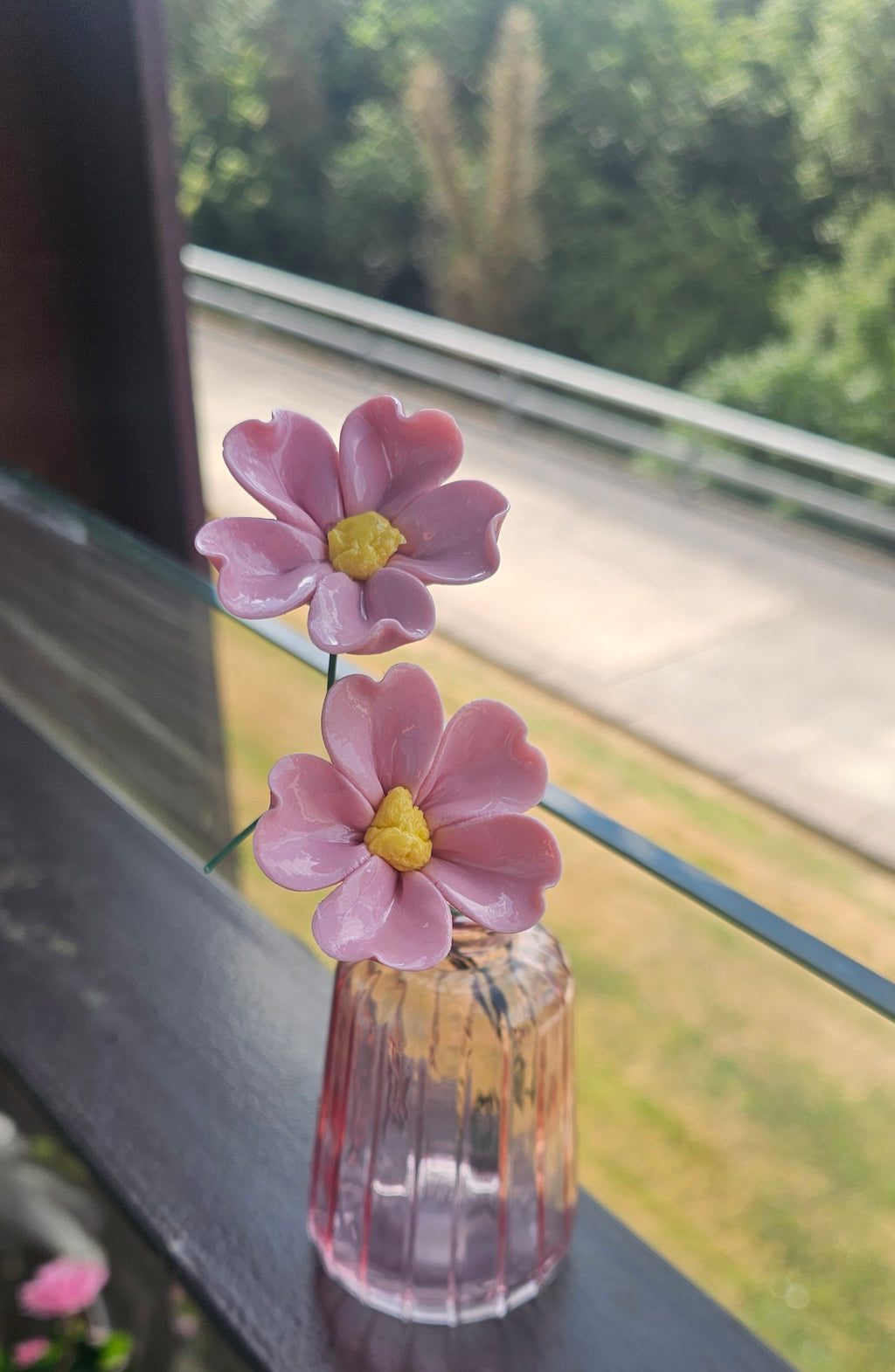 Singular pink ceramic flower