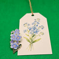 Forget-me-not pin with gift tag