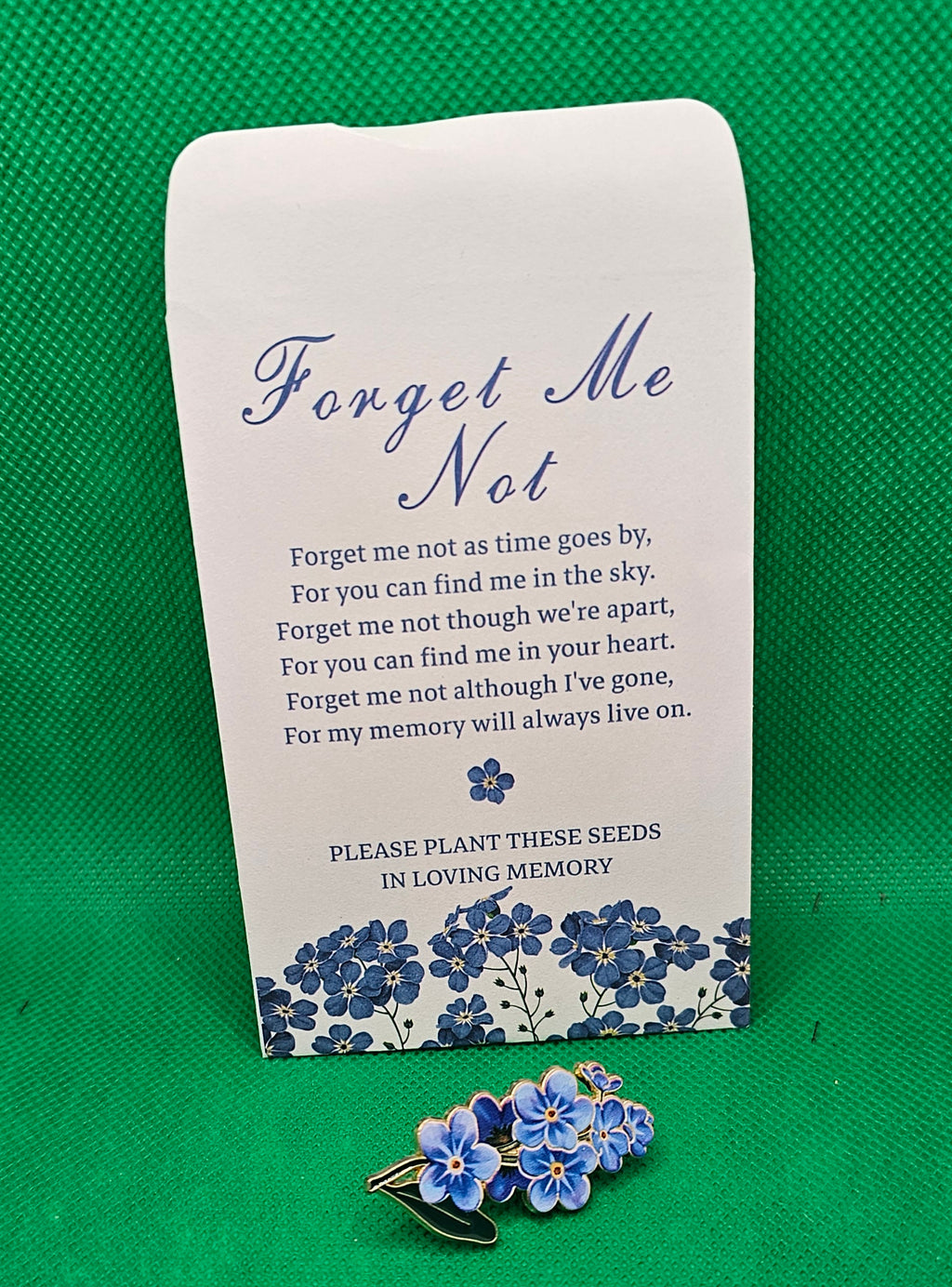 Forget-me-not pin with seed envelope